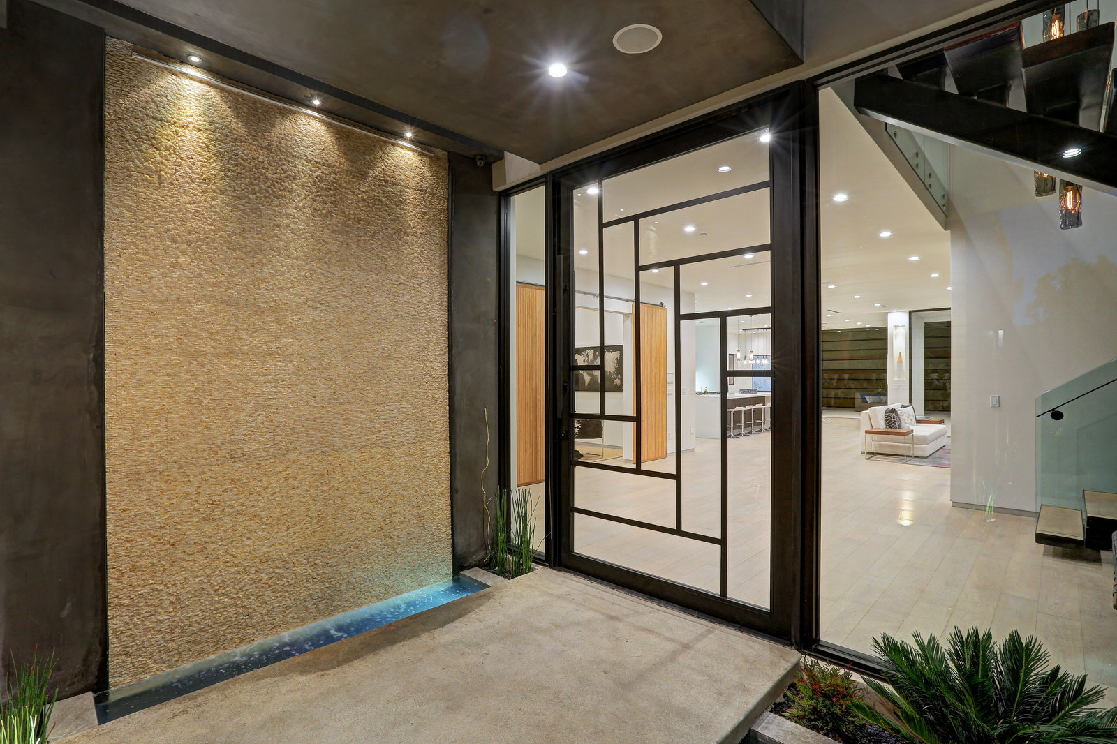 Maison De La Joie — Glass entry and illuminated water wall