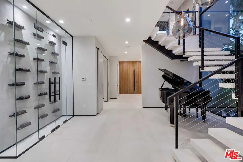 Casa Alegra — Wine display and open staircase